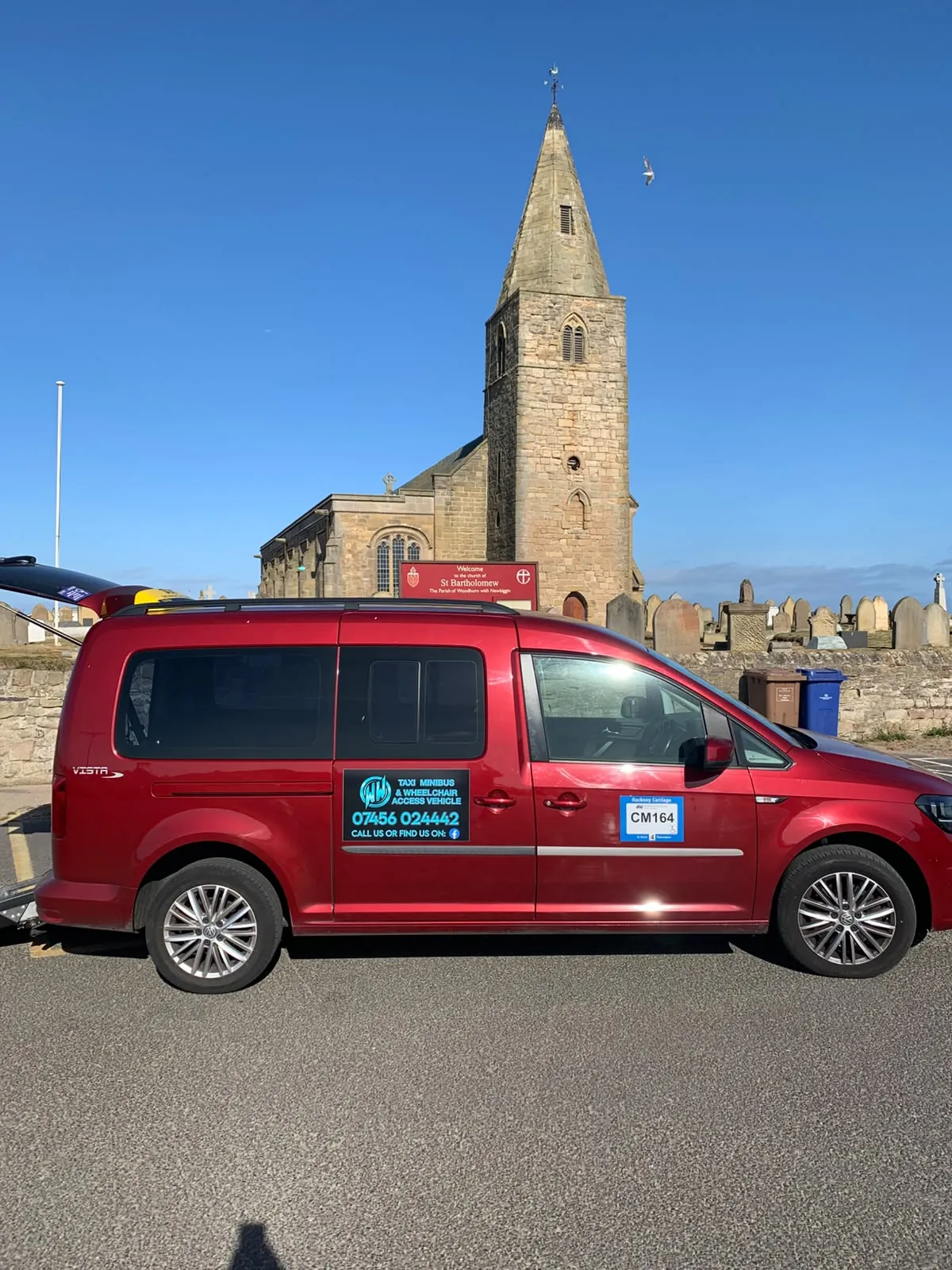 Wansbeck Wheels red taxi at Newbiggin-by-the-Sea