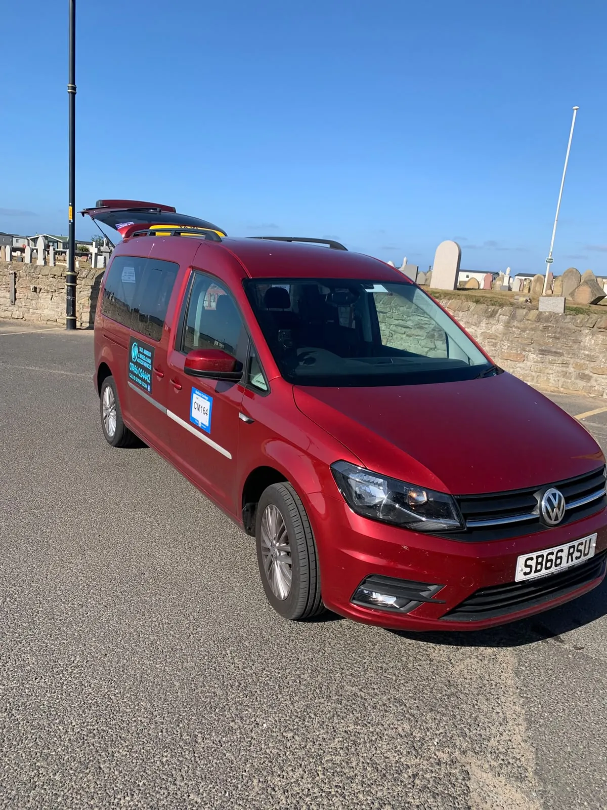 Wansbeck Wheels red taxi in Newbiggin-by-the-Sea